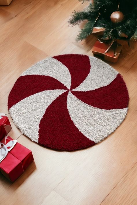 Elevate your holiday decor with our Hand-Tufted Round Christmas Candy Rug. Crafted with precision from soft, durable yarn, this delightful piece brings the spirit of the season to life. The felt backing ensures stability, while the option for customization allows it to fit perfectly in your space. Measuring 29.5 inches, it's a charming addition to any room. Embrace the festive cheer with this iconic Christmas candy rug, designed to spread joy and warmth throughout your home. Rug Christmas, Christmas Rug Diy, Christmas Tufting, Xmas Rug, Hand Tufted Rugs Design, Christmas Rug, Christmas Tufted Rug, Dollhouse Christmas Rug, Christmas Snowflake Rug