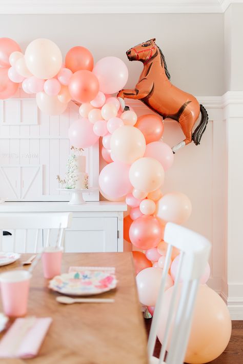 Recreate this adorable horse birthday party with these simple ideas for decorations, goodie bags, and activities Horse Balloon Garland, Girl Horse Party, Girl Horse Birthday Party, Horse Theme Birthday Party, Horse Party Decorations, Horse Birthday Party, Horse Balloons, Horse Themed Party, Saddle Club