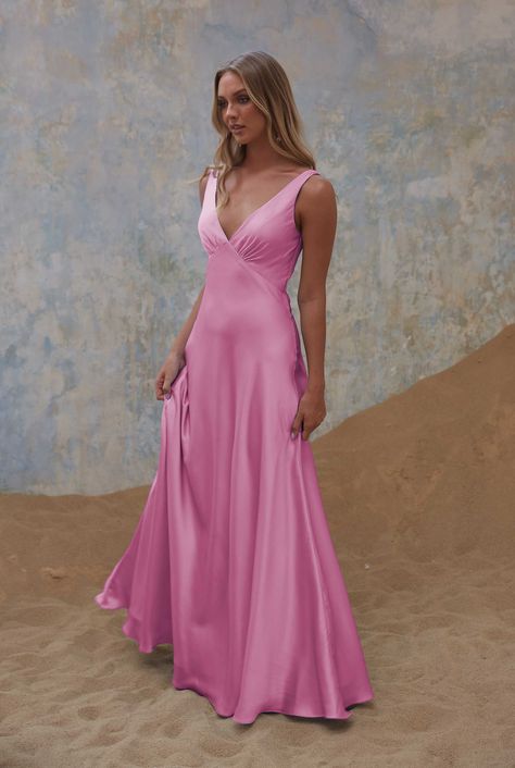 The Avonlea TO2428 Bridesmaid Dress is a sophisticated and timeless choice, designed to complement your special day with style and grace. Crafted from light stretch satin, this dress offers both comfort and a touch of luxury. The bodice features a flattering V-front neckline with an empire-cut waistline, accentuated by delicate gathers under the bust. This design creates an elegant and classic look. The A-line shaped bias-cut skirt adds an element of poise and sophistication to the dress. The dress construction includes inner bra cups and light-weight interfacing, ensuring a comfortable and tailored fit. The back zipper allows for easy wear, and the dress is fully lined with a satin lining, providing a luxurious finish. Elevate your bridal party with the Avonlea Bridesmaid Dress, a symbol Md Dresses, Dress Construction, Bias Cut Skirt, Style And Grace, Stretch Satin, Bra Cups, Rose Pink, Dress Backs, Easy Wear