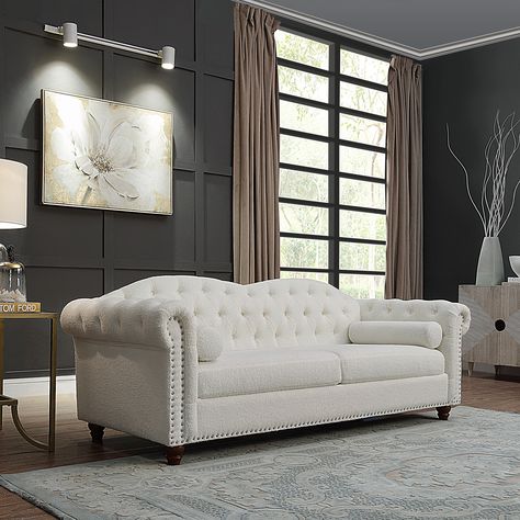 Description: Chesterfield style: Designed with the traditional Chesterfield style in mind, this piece hits all the key elements, with deep button tufting, nailhead accents, scrolled arms, and turned legs. Premium Sofa Design, White Chesterfield Sofa, Classic Traditional Living Room, Fabric Chesterfield Sofa, Latest Sofa, Button Tufted Sofa, Chesterfield Style Sofa, Latest Sofa Designs, Modern Sofa Couch