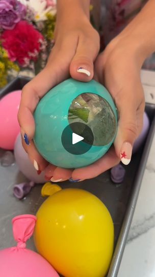 7M views · 36K reactions | Frozen Roses are amazing! 🌹😍 | Frozen Roses are amazing! 🌹😍
Janelle freezes flowers in balloons and the result is incredble. Definitely a showstopper for any party. | By Janelle & Kate | You pop it off just like that.
Grab your balloon in. See? It's in there. You can do it. If you
have a person to help you, it really does help but you can do
it on your own One more time. Here is the
balloon. And you just oh literally 2 seconds. It's so
easy. All you have your little ice balls. So I just cannot
wait to open these up for you because they're so cool. These
are 12 inch. These are just fancy edible packets of these
sprinkles. Some sprinkles and this is going to make the
entire ball super sparkly. Take all of my I shook them up
because they have some glitter in the Flowers In Ice Balloons, Flower Ice Balls Balloons, Balloon Ice Balls, Frozen Roses, Different Roses, Frozen Balloons, Frozen Rose, Bar Business, Flower Ice