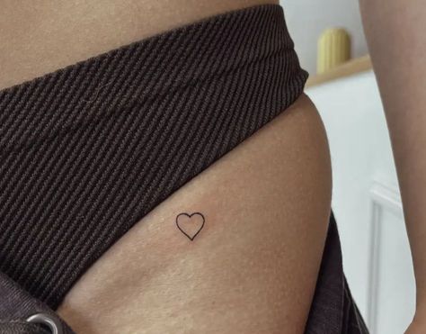 Small Heart With Butterfly Tattoo, Heart Tattoo Pelvis, Heart Tattoo Waist, Heart Tattoo Hip Bone, Thigh Heart Tattoo, Heart Tattoo Buttcheek, Heart On Hip Tattoo, Groin Tattoos For Women, Waist Tattoos For Women Side