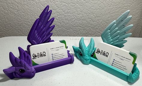 Display your business cards with the power of dragons, with these fiery 3D printed holders! Forged with innovative technology and sure to heat up any networking situation, these Dragon Business Card Holders will be sure to make a lasting impression. Bring the heat! 3d Printed Card Holder, Cool Things To 3d Print, 3 D Printer Projects, Cute 3d Printing Ideas, 3d Printing Ideas Useful, 3d Printer Ideas, 3d Printed Stuff, 3d Printed Gifts, Cool 3d Prints