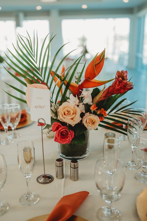 Bringing a touch of the tropics to the table. 🏝️  Venue: @harborviewloft Catering: @personaltouchdining Photography: @laurenogdenphoto Florist: @undetalle_floraldesign   #harborviewloft #personaltouchdining #couples #bride #groom #wedding #ido  #diversity #LGBTQIA #waterfrontweddings #sandiegoeventplanner #sandiegoeventvenue #outdoorceremony #allinclusivevenue #allinclusivewedding #sandiegoweddings #downtownsandiego #weddingvenue #eventvenue #sdcatering #sdfoodie #destinationwedding Tropical Simple Wedding, Fall Tropical Wedding Flowers, Tropical Spring Wedding, Fall Hawaiian Wedding, Wedding Table Decorations Tropical, Boho Tropical Wedding Decor, Tropical Wedding Arch Ideas, Chic Tropical Wedding, Tropical Reception Decor