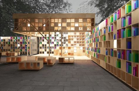 Constructed in Moscow’s Park Muzeon for Archiwood and Office 17, the book pavilion accommodates those with larger libraries, offering walls of shelf space. Extending from the covered space of the pavilion, walls of shelving provide readers with privacy both in and out of doors. Photo courtesy of Ruetemple Architectural Studio. Pavilion Architecture, Urban Furniture, Library Architecture, Book Pavilion, Outdoor Library, Public Library Design, Tiny Library, Public Space Design, Architectural Studio