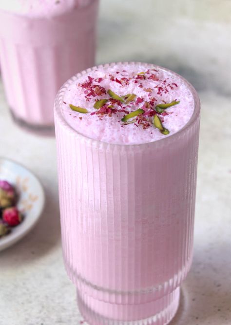 Rose lassi garnished with dried rose petals and pistachios South Indian Tomato Chutney, Rose Lassi, Sweet Lassi, Rooh Afza, Watermelon And Mint, Summer Special Drinks, Raspberry Breakfast, Lassi Recipe, Rose Drink