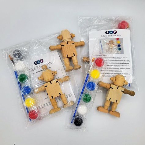 Our robot party favor painting kit includes 1 unfinished wooden robots and enough paint to really get your gears moving. Each robot's limbs are attached at the hips and shoulders with a stretchy elastic, allowing them to move and dance right along with you! The supplies for each robot will be individually wrapped in a cellophane bag to make it easy to hand out on the big day. Each individual party favor bag will include: 1 wooden robot doll 6 color acrylic paint strip paint brush step-by-step in Robot Party Decorations, Robot Party Ideas, Robot Themed Birthday Party, Robots Party Theme, Robot Birthday Party Decorations, Robot Party Favors, Wooden Robots, Strip Paint, Wooden Robot