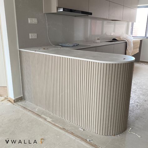 Incorporate calming curves to your kitchen island with rounded edges and pair it with our fluted panels for an elegant look. ✨ Fluted Panel Series: 160 (Slim) Fluted Panel Color: FPS-809 (Taupe) 💬 DM us to obtain our wall coverings catalog ☎️ Hotline: +65 8111 4208 ✉️ Email: hello@vwalla.co 📍 Address: 10 Tampines North Drive 4, #04-06 JTC Space, Singapore 528553 Flute Panel Kitchen Island, Fluted Panel Island, Slim Island Kitchen, Kitchen Fluted Panel, Fluted Island Bench, Fluted Wall Dining Room, Flute Kitchen Cabinets, Curve Kitchen Island, Fluted Panel Wardrobe