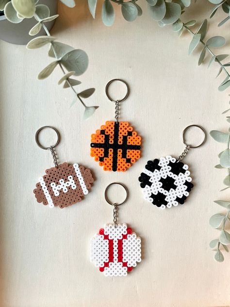 This listing is for one keychain. These are finished products ready to ship. These make excellent party favors or gifts. Need more? Send me a message, we will be happy to make more. (A discount is provided for large orders of 10+) Iron Beads Ideas Cute Easy, Sports Perler Bead Patterns, Kc Chiefs Perler Beads, Baseball Perler Bead Pattern, Perler Beads Basketball, Perler Beads Football, Soccer Perler Beads, Basketball Perler Beads, Fusible Beads Ideas