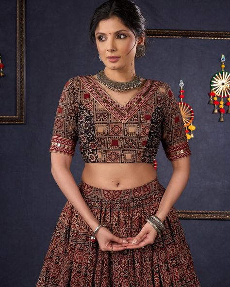 Indulge in the luxurious and exclusive world of fashion with our Elegant Maroon & Black Ajrakh Lehenga. Adorned with intricate Ajrakh print, this stunning lehenga comes with a matching blouse and dupatta, creating a timeless and elegant ensemble. Embrace sophistication and elevate your style with this beautiful piece. #sujatra #sujatraglobal #sujatralehenga #readymadelehenga #stitchedlehengacholi #lehengacholi #ajrakhprints #ajrakhlehenga #lehengalove Ajrakh Lehenga, Ajrakh Dupatta, Ajrakh Prints, Lehenga Choli, World Of Fashion, Lehenga, Return Policy, Size Chart, Black