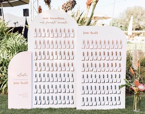 Amy Park on Instagram: “Loved my brides idea of luggage tags as escort cards and also as favors! Was a little nervous about this installation because we did it on…” Travel Tag Wedding Favor, Luggage Tag Wedding Favors Display, Travel Tag Seating Chart, Luggage Tag Wall Wedding, Plane Ticket Seating Chart, Luggage Tag Name Places, Luggage Tags For Wedding Guests, Wedding Seating Chart Luggage Tags, Boarding Pass Seating Chart