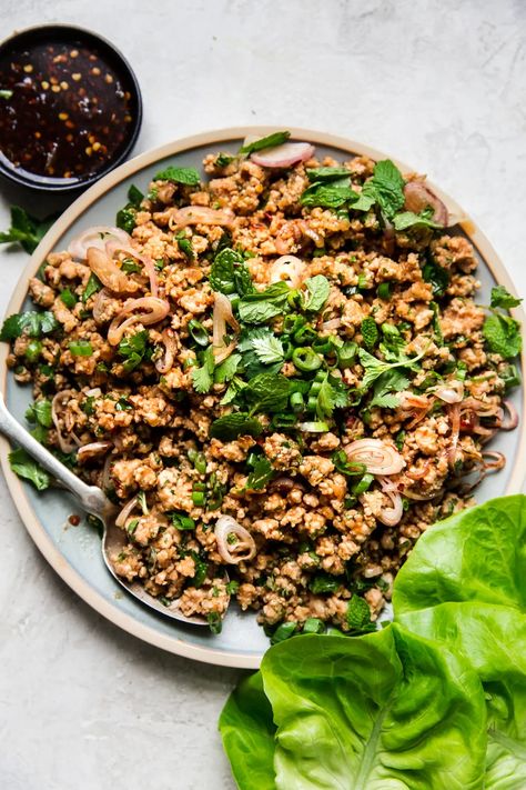 Shallots and mint, fish sauce and chili paste, lime zest and soy sauce—our easy, healthy chicken larb lettuce wrap recipe hums with the bold, juicy, bright flavors of Thailand. Ground Turkey Larb Recipe, Thai Ground Chicken Lettuce Wraps, Ground Turkey Larb, Chicken Larb Recipes Thai, Chicken Larb Recipe, Thai Larb Recipe, Easy Larb Recipe, Pork Chop Recipes Instant Pot, Larb Recipe Thai