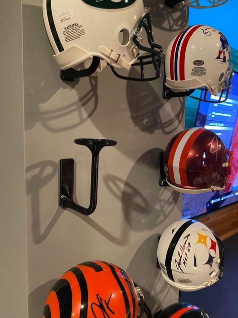 3D Printed PLA plus mini helmet holder.   Make any man cave, room, office, garage look amazing!   Sticks on with command 3m tape INCLUDED. Many color options available! Thank you for looking.   Will have large helmet holders and screw in mini holders available soon. Mini Football Helmet Display, Mini Helmet Display Ideas, Football Man Cave Ideas, Football Room Ideas, Sports Room Man Cave, Man Cave Ideas Sports, Garage Man Cave Ideas, Sports Cave, Football Man Cave