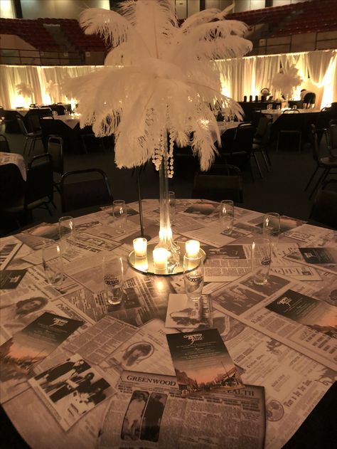 Table Toppers created from newspaper clippings from 1917-2017 for a 100 anniversary gala. Prom Aesthetic Theme, Met Gala Ball Theme, Met Gala Table Decor, Vintage Prom Decorations, Metgala Themed Party, Old Hollywood Aesthetic Party Decor, Vogue Prom Theme, Old Hollywood Prom Theme Decoration, Great Gatsby Theme Decor