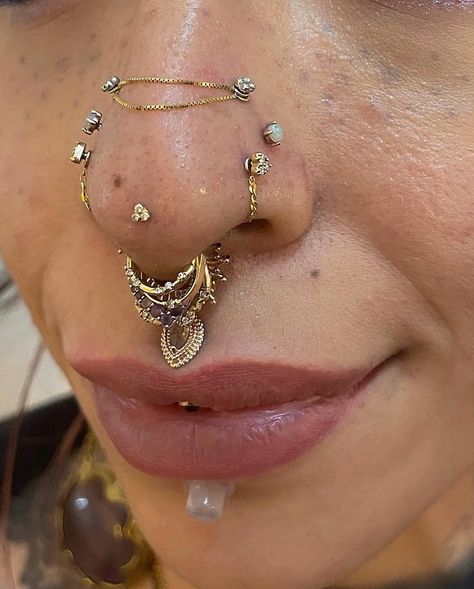 Rinku on Instagram: “"From basic to bold, this nostril piercing has come a long way! Swipe Left -to see the journey from a double high nostril to a stunning…” Septril Piercing Nose, Madussa Piercing, Gold Facial Piercings, Double Septum Piercing, Facial Piercings Aesthetic, Unique Piercings Face, Dainty Face Piercings, Vertical Philtrum, Chic Tattoo Ideas