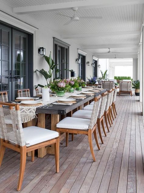 Rope and teak chairs align at a long wood and concrete outdoor table featuring a crochet table runner and styled floral tablescapes. Dining Rooms, Teak Dining Chairs, Dining Chair Design, Outdoor Dining Area, Outdoor Tables, Outdoor Dining Table, Backyard Patio, Dining Tables, Chair Design