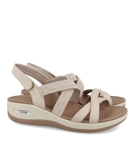 Sandalia mujer Skechers Arch Fit Sunshine Luxe Lady 163387 en color taupe. Características: Cierre de velcro, altura de 5 cm, piso de goma, exterior textil y sintético, interior textil y plantilla sintética.   Skechers "LA COMPAÑÍA DE TECNOLOGÍA DE CONFORT™". Impulsada por la innovación, Skechers ofrece una colección completa de zapatos, zapatillas, botas, botines y chanclas para hombres, mujeres y niños.  Plantilla Skechers Memory Foam: Es una espuma de poliuretano. Pura comodidad en los pies, la plantilla se adapta a la forma del pie, disipando la presión y ofreciendo un confort instantáneo. Skechers Memory Foam, Memory Foam, Outlet