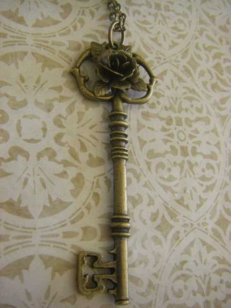 Great accessory featuring a long (3 inch) ornate bronze key charm. I added a beautiful 3D bronze rose for a Victorian touch. The key has a detailed bit and bow and hangs on a lovely brass chain that is 24 inches. If you desire a different length, please let me know. I can adjust it to be shorter or slightly longer. Your key necklace will arrive beautifully packaged, ready for gifting. Key Aesthetic, Victorian Key, Secret Garden Book, Bronze Accessories, Key Charm Necklace, Unique Key, Old Keys, Vintage Key, Key Jewelry