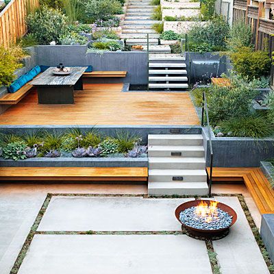 Turn an uneven slope into California-style outdoor space for grilling, entertaining, and gardening. Sloped Backyard Landscaping, Terraced Landscaping, Terraced Backyard, Sloped Yard, Sloped Backyard, Tiered Garden, Sloped Garden, Diy Backyard Landscaping, Desert Homes