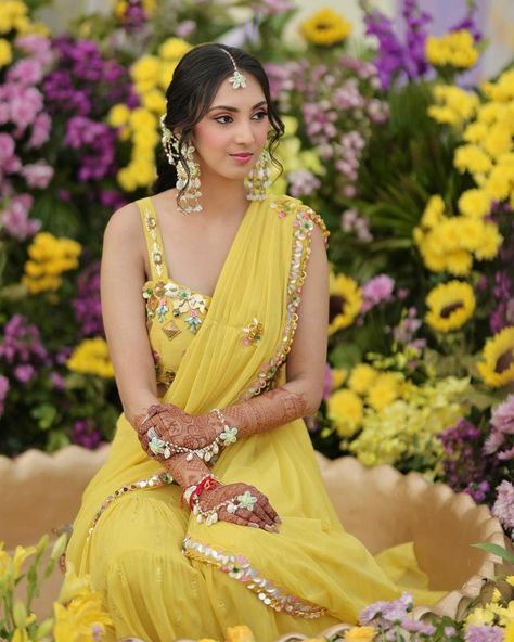 Ending the day with another sunshine beauty giving Haldi outfit inspiration in this beautiful yellow sharara saree dress. Her haldi dress is seeking attention and swipe to see the gorgeous sea shell accessories and floral braid, which will also make you say wow. 💛 Bride @rachnashah4 Makeup @makeoverbyindu Hair @hairbydeepak Photographer @memoirs_jaipur Follow @wishnwed for more such Haldi outfits ideas. #indianweddings #weddingideas #weddinginspiration #indianwedding #bride #groom #wedd... Dress For Haldi Function Indian Weddings, Groom Haldi Decoration, Bride Haldi Dress, Haldi Dress For Bride Indian, Haldi Outfit For Bride Indian, Haldi Outfit For Men, Haldi Photoshoot Poses, Haldi Bridal Outfit, Haldi Dress For Groom