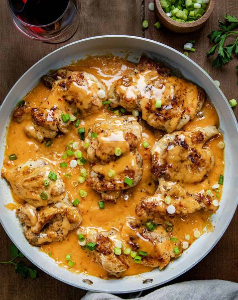 Skillet Bang Bang Chicken Thighs are seasoned boneless, skinless chicken thighs cooked to juicy perfection in a skillet, and then coated in a creamy, slightly spicy homemade Bang Bang sauce. And, this main course can be on the table in less than 30 minutes! Healthy Chicken Thigh Recipes, Bang Bang Sauce, Bang Bang Chicken, Boneless Chicken Thigh Recipes, Boneless Skinless Chicken Thighs, Boneless Chicken Thighs, Skinless Chicken Thighs, Health Dinner Recipes, Boneless Skinless Chicken