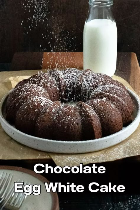 Chocolate egg white cake on plate with confectioner's sugar being sprinkled on it. Egg White Recipes Dessert, Egg White Cake, White Chocolate Mousse Cake, White Recipes, Chocolat Cake, Egg White Recipes, French Buttercream, Snacking Cake, Italian Buttercream