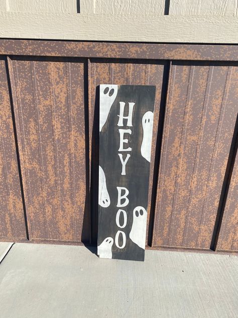 Welcome your guests this Halloween season with this adorable Hey Boo front porch leaner sign! Spooky Welcome Sign Diy, Ghost Porch Sign, Halloween Leaning Sign, Front Porch Leaner Sign, Diy Boo Sign, Halloween Door Leaner, Wooden Welcome Signs Front Porches Diy, Halloween Porch Leaner, Diy Welcome Sign Wood Front Porches