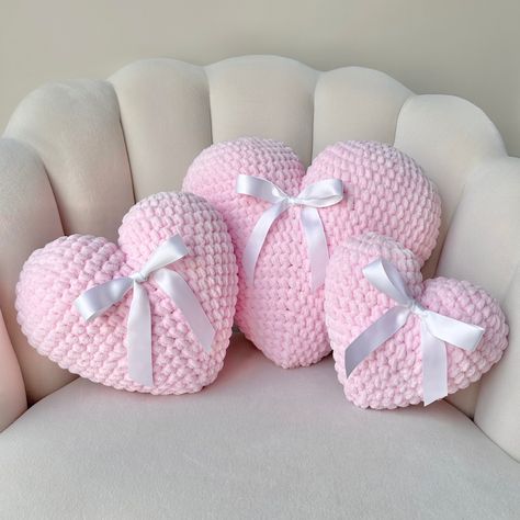 "Handmade crochet heart shaped pillow. Made from extra soft chenille plush yarn. Bow is removable if you prefer the pillow without it.  3 sizes are available in separate listings. This listing is for the large size pillow, which measures approximately 12x12\" Listings for other sizes: Small: https://coquettecrochetco.etsy.com/listing/1674336567 Medium:  https://coquettecrochetco.etsy.com/listing/1660173968 Custom color requests are available: please note that custom colors will take longer." Love Pillow, Heart Shape Pillow, Crochet Bow Pillow, Heart Shaped Pillow, Bow Pillows, Heart Plush, Knitted Heart, Pink Throw Pillows, Crochet Heart Pattern