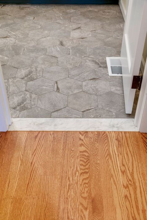 The Carrara Marble threshold between the hardwood flooring in the bedroom to the bathroom tile add a period detail to the new space. Floor Threshold, Marble Threshold, Building A Home, Primary Suite, Home Addition, New Space, Bathroom Tile, Hardwood Flooring, The Bathroom