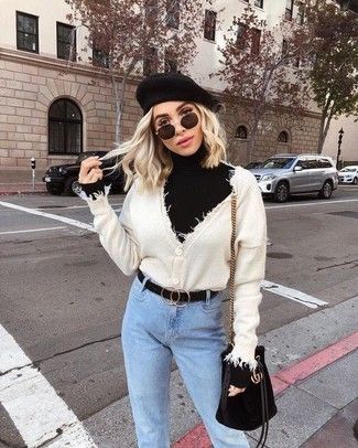 Women's Beige Cardigan, Black Turtleneck, Light Blue Jeans, Black Suede Bucket Bag | Women's Fashion | Lookastic.com Black Barett Outfit, Queenstown Outfit, Black Beret Outfit Winter, Black Beret Outfit, White Beret Outfit, Baret Outfit, Vietnam Outfit, Beret Outfits, Scottish Hat