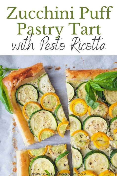 Ready in under 30 minutes this Zucchini Puff Pastry Tart with Pesto Ricotta is the perfect summer appetizer. Discover the best recipe for an easy and delicious zucchini puff pastry tart. | zucchini tart with puff pastry | zucchini tart with ricotta | zucchini tart with pesto | zucchini appetizer recipe | vegetable tart recipe | Zucchini Ricotta Pesto Tart, Puff Pastry Zucchini Tart, Zucchini Tart Puff Pastries, Zucchini Appetizers For Party, Puff Pastry Zucchini, Aperitivo Party, Tart With Puff Pastry, Zucchini Appetizer Recipes, Vegetable Tart Recipes