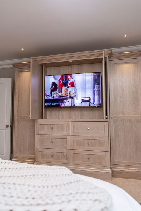 Seamlessly blending technology and design, our custom cabinets with built in TV and pocket doors create the perfect bedroom escape. #LuxuryHomes #GrandDesigns #BespokeDesigns #HighEndInteriors #InteriorDesign #MediaWall #MediaWallDesign #ElegantSpaces #ExclusiveDesigns #AV #AVGeek #LuxuryEvents #ExclusiveEvents #TVWallDesign Built In Closet Wall Bedroom With Tv, Built In Tv Bedroom, Bedroom Tv Built In, Bedroom Built In Wardrobe With Tv, Built In Closet With Tv, Primary Bedroom Tv, Bedroom Built Ins For Tv, Built In Tv, Audio Visual Installation