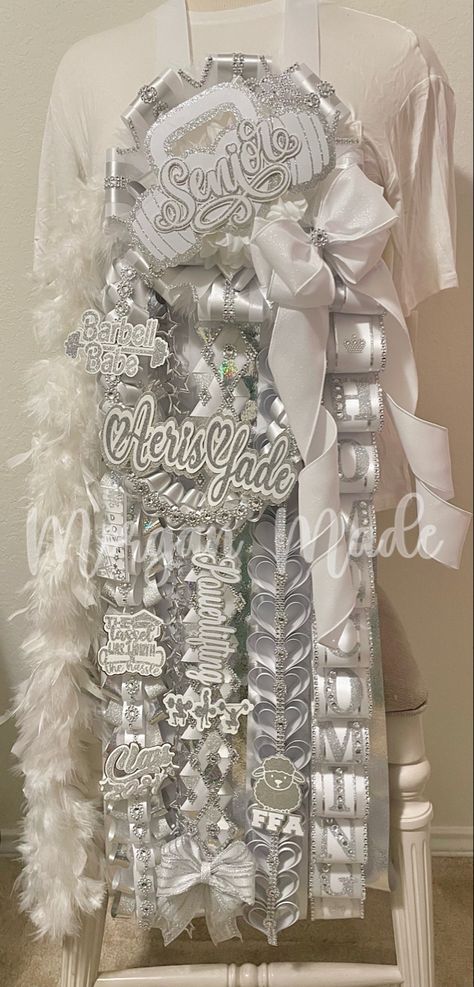 homecoming mum
white and silver homecoming mum
senior homecoming mum
hoco mum
senior mum
morgan made mums Homecoming Mum Junior Ideas, All White Mums Homecoming, Silver And White Mums, Mum And Garter Homecoming, Homecoming Mum Inspiration, Junior Hoco Mum, White And Silver Homecoming Mum, Senior Year Homecoming Mum, Big Mums Homecoming