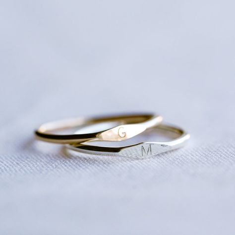 A Dainty Tiny Signet Ring, customised with a letter/initial of your choosing. The perfect ring for stacking! Each letter is hand stamped in our 1.5mm tiny block font (uppercase only). Available in sizes 2 US to 15 US Need help with sizing? Look at our size guide or purchase our ring sizer Due to its handmade nature, there may be some colour variances where the solder seam is Each Stamp + Shine piece is made from scratch in our little studio in Melbourne, Australia. The process begins with a clea Wedding Ring Initial, Dainty Initial Ring, Cute Couple Jewelry, Ring With Initials, Alphabet Ring, Customised Jewellery, Stamp Ring, Initial Rings, Couples Jewelry