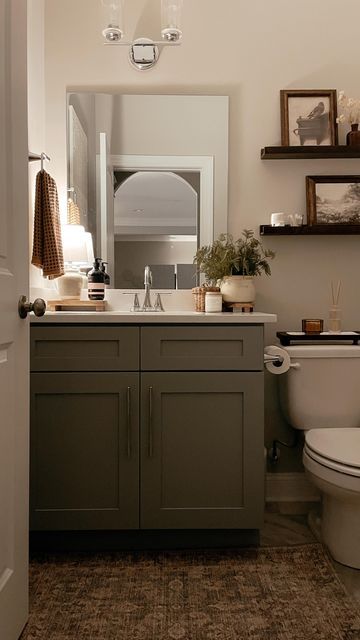 Bathroom Decor Styling, Small Home Office Window, Bathrooms Sinks And Vanities, Powder Room Over Toilet Ideas, Moody Bathroom Cabinets, Dark Bathroom Makeover, Small Bathroom With Round Mirror, Boho Modern Bathroom Decor, Home Ideas On A Budget Decorating