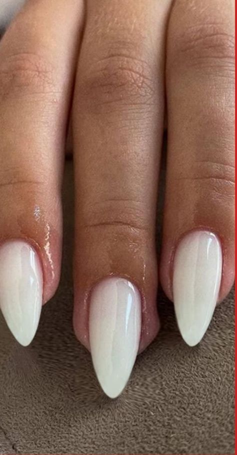 Indulge in the timeless elegance of milky white almond nails with our exquisite collection. Elevate your manicure game and add a touch of sophistication to Off White Short Almond Nails, Glossy Milky White Nails, White Almond Nails With Design Classy, Unique Bridal Nails, White Almond Nail Designs, Bridal Nails Almond Shape, Basic White Nails, Milky White Almond Nails, Timeless Nails