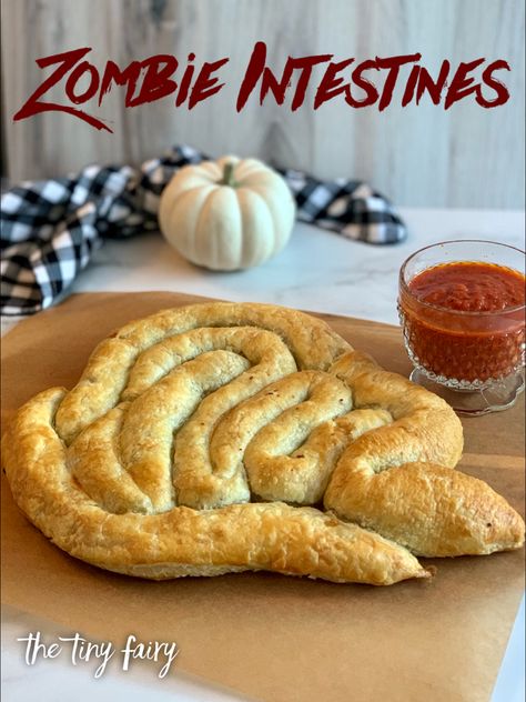 Puff pasty filled with an itslian sausage filling with a side of marinara sauce. Zombie Party Food, Italian Sausage Stuffing, Zombie Snacks, Sausage Puffs, Zombie Food, Halloween Breakfast, Spooky Halloween Treats, Sausage Stuffing, Cheese Puff Pastry