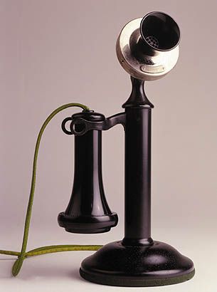 The candlestick telephone was common from the late 1890s to the 1930s. It featured a mouth piece (transmitter), and a receiver (ear phone) that was held by the user to the ear during a call. When not in use, the receiver rested in the fork of the switch hook, which disconnected the audio circuit from the telephone network. The main producers of these telephones were Western Electric, Automatic Electric Co., Kellogg Switchboard & Supply Company, and Stromberg-Carlson. Candlestick Phone, Candlestick Telephone, Antique Phone, Alexander Graham Bell, Telephone Vintage, Antique Telephone, Vintage Phones, Phone Booth, Vintage Telephone