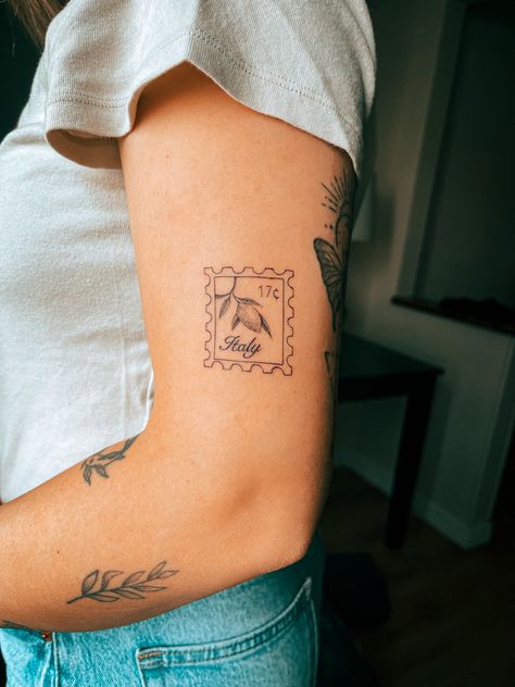 Fine line detailed Italy lemon stamp tattoo on arm Lemon Stamp, Cleveland Tattoo, Italy Stamp, Italy Tattoo, Stick And Poke Tattoo, Small Girly Tattoos, Stamp Tattoo, Flash Designs, Hibiscus Tattoo