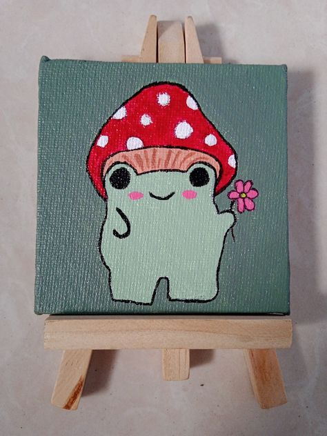 mushroom frog holding a flower 🌸 Frog Holding A Flower, Frog Painting Easy, Cute Froggy, Mushroom Painting, Mushroom Frog, Cute Easy Paintings, Holding A Flower, Mushroom Paint, Simple Canvas Paintings