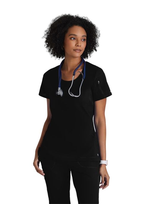 PRICES MAY VARY. Comfort Meets Function: Made with revolutionary temperature-regulating technology, this modern-fitting, scoop neck scrub top features perforated sleeves, knit and perforated body panels, and curved seaming; LENGTH | 26" (Center Back) Intelligent 2-Pocket Design: Featuring 2 pockets, including a perforated chest patch pocket and a sleeve zipper pocket, this anti-static scrub top has quick-shed technology to help veterinarians, vet techs and other medical workers maintain a clean, Womens Scrub Tops, Womens Scrubs, Medical Scrubs, Eco Friendly Fabric, Running Tops, Top For Women, Professional Look, Scrub Tops, Pocket Design