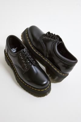 Classic leather platforms from Dr. Martens. Constructed from a polished smooth leather with a low silhouette, lace-up fastening, a pull tab at the heel and signature yellow stitching pairing the upper and outer sole. **Content + Care** \- Leather, rubber \- Spot clean | Dr. Martens 8053 Quad Leather Platform Shoes - Black UK 5 / EU 38 at Urban Outfitters Dr Martens School Shoes, Cute Black Shoes For Women, Low Dr Martens, Dr Martens 8053 Quad, Low Doc Martens, Dr Martens Low, 8053 Quad, Dr Martens 8053, Doc Martens Shoes