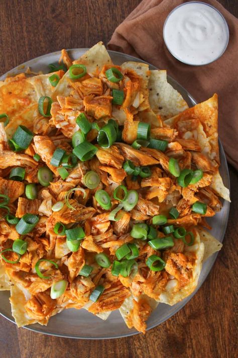 Make these 7-ingredient loaded buffalo chicken nachos in 20 minutes for an easy, protein-heavy game day snack or dinner. Buffalo Chicken Nachos, Chicken Nachos Recipe, Homemade Nachos, Group Food, Comfort Dinner, Easy Protein, Chicken Nachos, Game Day Snacks, Winter Recipes