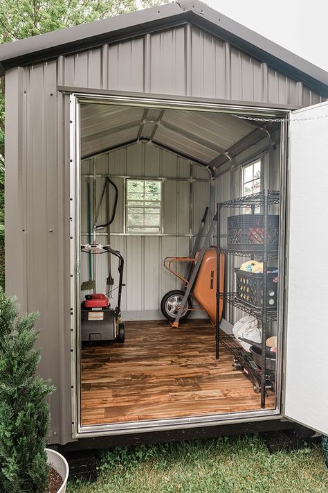 If you're planning on buying a shed for your outdoor tools, but don't love the look of it, you can easily make some adjustments so it's easier on the eyes. And best of all? It won't break your bank. Click for seven tips. Diy Metal Shed, Metal Shed Makeover, Sheds Ideas Backyard, Cool Sheds, Outdoor Shed, Shed Makeover, Shed Floor, Shed Interior, Small Sheds