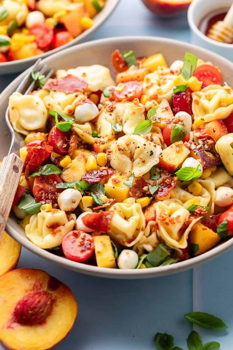 Ready to have the most popular dish at the barbecue? Dig into my hot honey pasta salad, made with crispy prosciutto, mozzarella, and fresh peaches. With a base made from tortellini, this dish is bright, flavorful, and super easy to make. Keep this recipe handy, because everyone will be begging for it! Honey Pasta, Prosciutto Mozzarella, Crispy Prosciutto, Pasta Salad With Tortellini, Tortellini Pasta, Chicken Orzo Soup, Lemon Chicken Orzo Soup, Fresh Peaches, Hot Honey