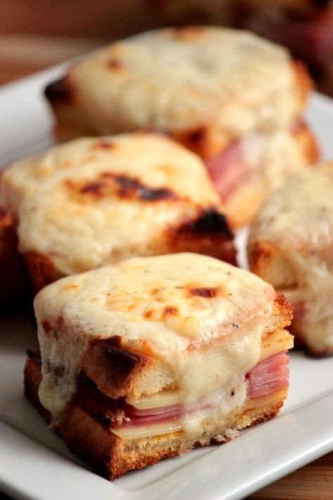 Mini Croque Monsieurs might sounds fancy but they're really just perfectly baked ham and cheese sandwiches with a simple cheesy Bechamel Sauce on top! Ham And Cheese Sandwich, Bechamel Sauce, Baked Ham, God Mat, Think Food, Cheese Sandwiches, Breakfast Buffet, Ham And Cheese, Appetizer Snacks