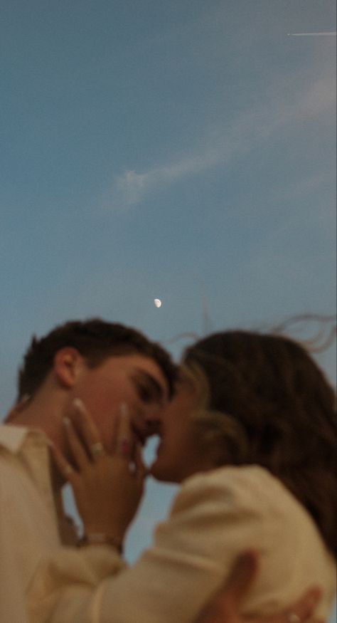 Blue sky, moon in the sky, Two people in love under the moon 
Lovers underneath the moon Watching Moon Together Aesthetic, Watching Moon Couples, Couple Watching Moon Together, Couple Watching Moon, Night Couple Photography, Couples At Night, Lovers Poses, Pasandida Aurat, Lovers Photoshoot