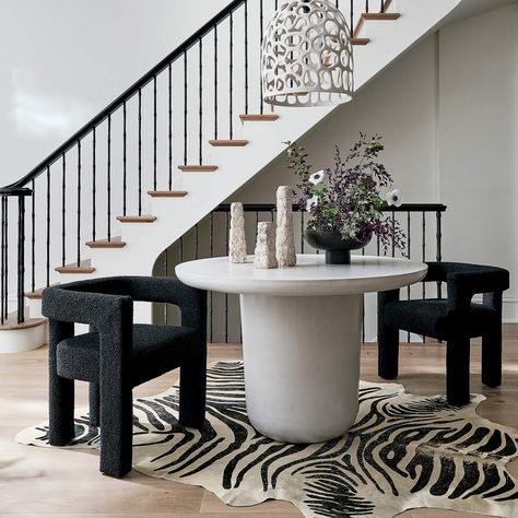 15 Boucle Chairs That Will Make A Statement - Happily Inspired Round Concrete Dining Table, Tattoo Modern, Zebra Hide, Fabric Lounge Chair, Concrete Dining Table, Black Chair, Entry Table, Dining Arm Chair, Table Seating