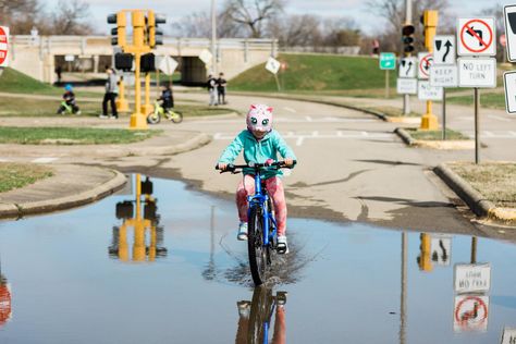 Many kids dream about the day they can get behind the wheel and out on the road. Until that time comes, did you know that Peoria Park District offers a place for them to “drive” around on their bicycles? Bicycle Safety Town offers a unique experience for bikers of all ages and skill levels to learn and play on nearly 4,000 feet of one-way streets, curves, traffic signals, overpasses, and more! Bring your helmets on and enjoy the ride. Amenities -Pets Welcome -Picnic Tables -Playgrounds -Public R Bicycle Safety, Traffic Signal, Play To Learn, Picnic Table, Hiking Trails, Bicycle, Bring It On