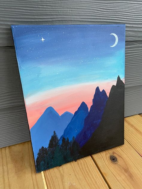 Acrylic Painting of a view of blue mountains and a forest in the distance with a pink and blue star-studded sky at sunset as background. Mountains In The Distance Painting, Elementary School Painting Ideas, Painting Ideas Of Nature, 16x20 Painting Ideas, Painting Ideas Deep Meaning, Cute Acrylic Painting Ideas Easy, Blue Background Painting Ideas, Mountain Canvas Painting Easy, Sky View Painting